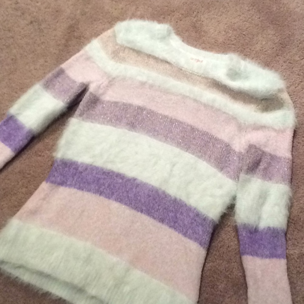 A fuzzy sweater for older girls.